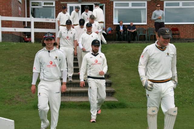 Caistor take to the field led by skipper Gareth Johnson (right) EMN-160620-100643002