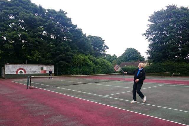 Two club members enjoy a game on one of the hard courts at Spilsby Lawn Tennis Club.