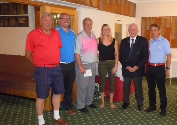 Last year's winning team with Emma Young from The Lincolnshire and Nottinghamshire Air Ambulance and Market Rasen Rotary Club Secretary Andrew Dalrymple. EMN-160620-104556002