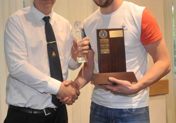 Mickey Stones collects the award.