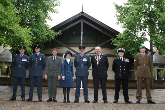 Launching Armed Forces Week with the raising of the flag, from left - NKDC chairman Coun John Money, Coun Mike Gallagher (Deputy Leader of NKDC), High Sheriff of Lincolnshire Jill Hughes and Wg Co Tom Ashbridge flanked by Tri-Service representatives. EMN-160620-162905001