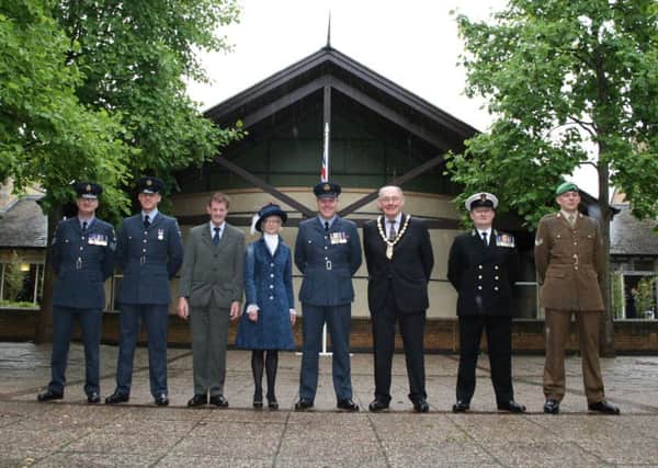 Launching Armed Forces Week with the raising of the flag, from left - NKDC chairman Coun John Money, Coun Mike Gallagher (Deputy Leader of NKDC), High Sheriff of Lincolnshire Jill Hughes and Wg Co Tom Ashbridge flanked by Tri-Service representatives. EMN-160620-162905001