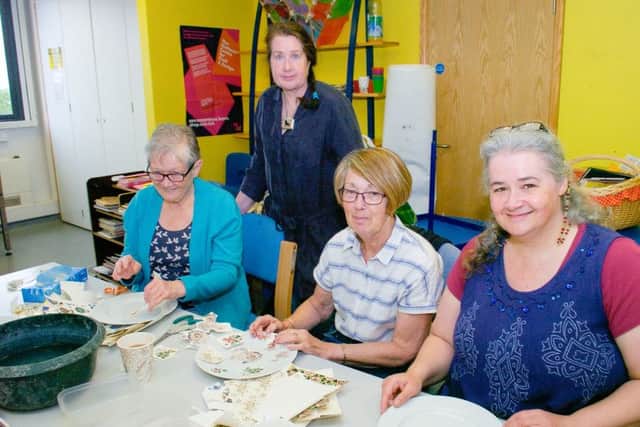 Ceramic decal workshop using professional transfers on Limoges ceramic.