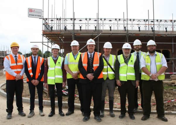 NKDC members and officers with representatives from Lindum Construction outside the Passivhauses being built at Kyme Road, Heckington. EMN-160623-155653001