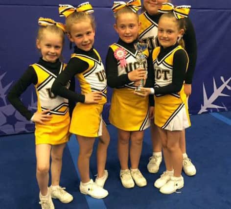 United's Cheer Team had reasons to celebrate. 04fi1WNCd6yp5bJwE_uY