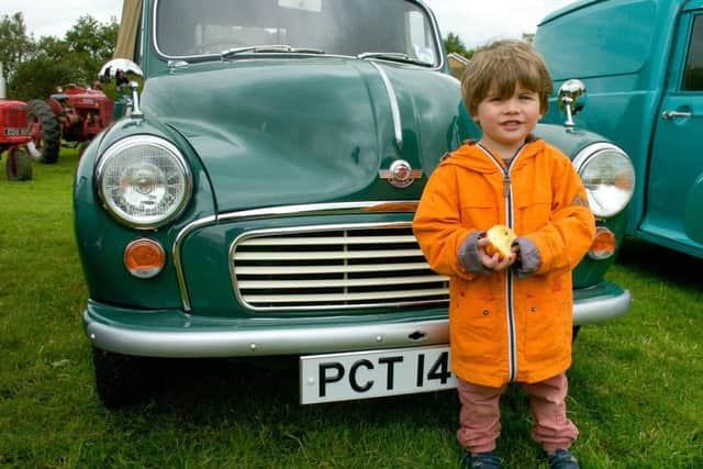 Finn Tarrant, aged three, of Kirkby Underwood with his favourite car at the show - a Morris Minor. EMN-160623-164015001