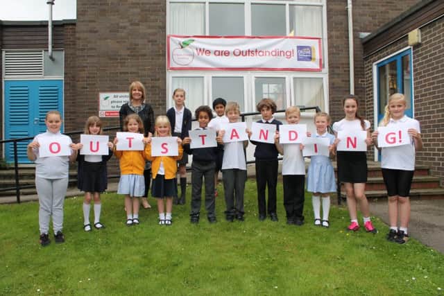 Head teacher Tracey Roberts with pupils at Kidgate Primary Academy.