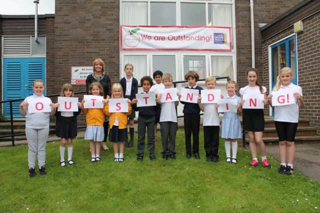 Head teacher Tracey Roberts with pupils at Kidgate Primary Academy.