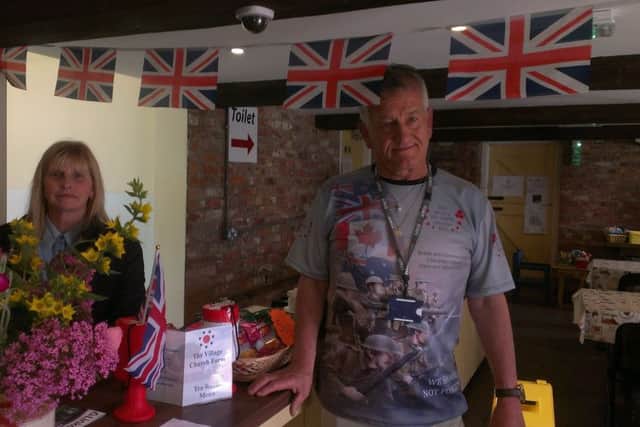 Kellie North, assistant manager at the Village Church Farm museum, with volunteer Rodney Martin saluting Armed Forces Day with a special wartime exhibition. ANL-160625-182206001