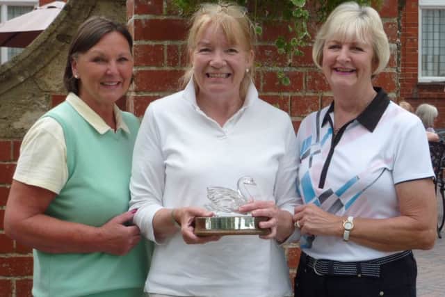 Lady captain Penny Buckley (left) with Swan Trophy winner Wendy Beaumont and sponsor Di Everitt (right) EMN-160627-103226002