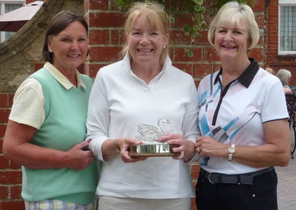 Lady captain Penny Buckley (left) with Swan Trophy winner Wendy Beaumont and sponsor Di Everitt (right) EMN-160627-103226002