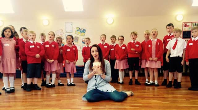 Pupils from Huttoft Primary School with Natalie Montakhab, soprano in Garsington Opera Choir
