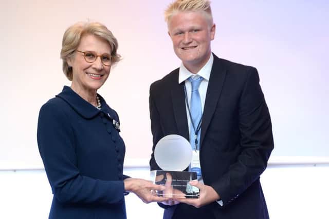 David Cheer is seen collecting his Young Volunteer of the Year trophy. 650766763