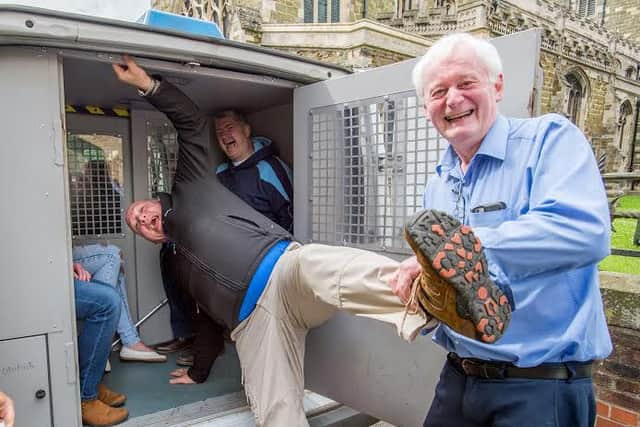 In you go: Mayor Bill Aron gives Jonathan Ferrari a helping hand into the police van EMN-160629-165601001