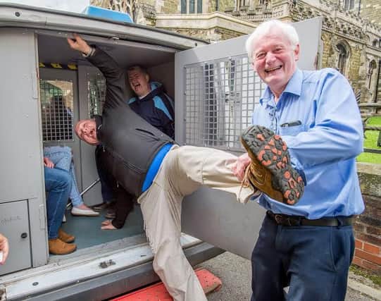 In you go: Mayor Bill Aron gives Jonathan Ferrari a helping hand into the police van EMN-160629-165601001
