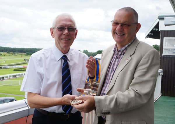 Keith Patrick has handed over the presidential chain to Richard Lewis. EMN-160407-125542001