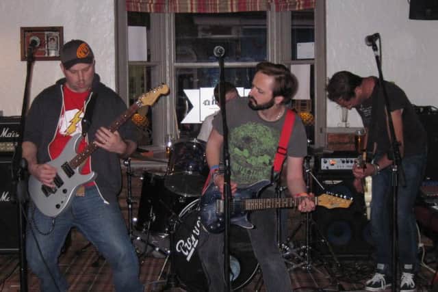 Glass Onion rocking out at the Beer and Bean. EMN-160107-130434001