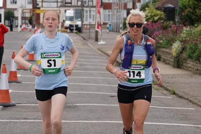 Ellie Hawse became the Seabank's youngest finisher, aged 13, running with ckubmate Janine Stones EMN-160407-102550002