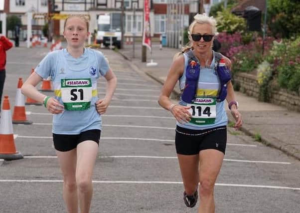 Ellie Hawse became the Seabank's youngest finisher, aged 13, running with ckubmate Janine Stones EMN-160407-102550002