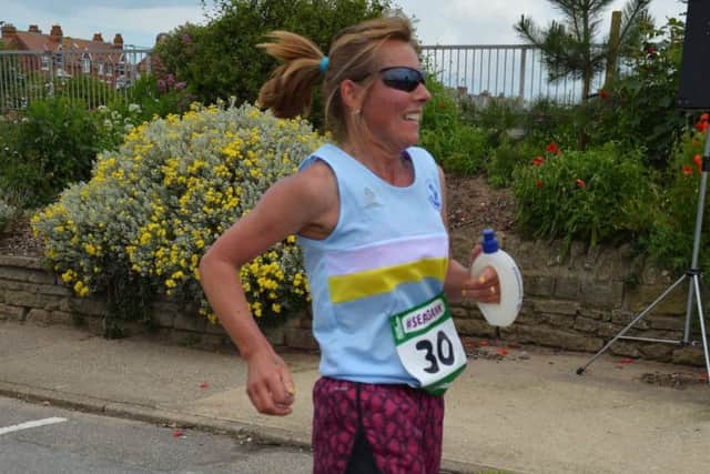 Paula Downing secured an historic win in her 64th marathon EMN-160407-102603002