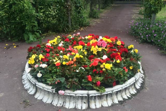 The Queen's Jubilee Fountain has been dismantled and the base filled with flowers.