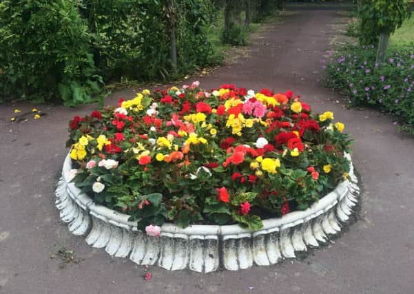 The Queen's Jubilee Fountain has been dismantled and the base filled with flowers.