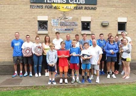 Boston Tennis Club's champions and runners-up line up. DTvaCKzjicFS5-dVgN8-