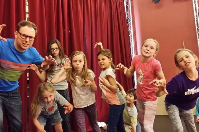 Getting into character ... Kei Bailey and children during a previous project.