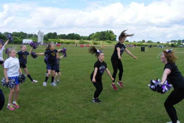 Osbournby School pupils try cheerleading. EMN-160607-150004001