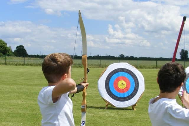 Brant Broughton School try their hand at archery. EMN-160607-145926001
