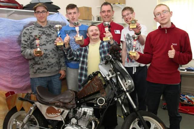 Linkage College students with their winning custom-built motorbike. ANL-160607-155846001