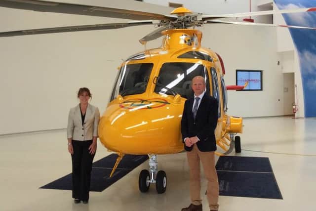 Karen Jobling, Chief Executive of Lincs & Notts Air Ambulance, and Jack OHern, joint chairman of Lincs & Notts Air Ambulance Board of Trustees, with the AW169 EMN-160607-140012001