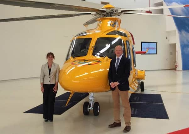 Karen Jobling, Chief Executive of Lincs & Notts Air Ambulance, and Jack OHern, joint chairman of Lincs & Notts Air Ambulance Board of Trustees, with the AW169 EMN-160607-140012001