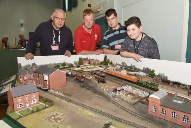 Sleaford and District Railway Club first ever show. Members of the club L-R Derek Clifford, Andrew Sharpe, Zak Harding and Oscar Clifford 13. EMN-160807-134146001