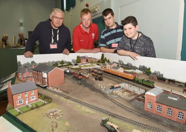 Sleaford and District Railway Club first ever show. Members of the club L-R Derek Clifford, Andrew Sharpe, Zak Harding and Oscar Clifford 13. EMN-160807-134146001