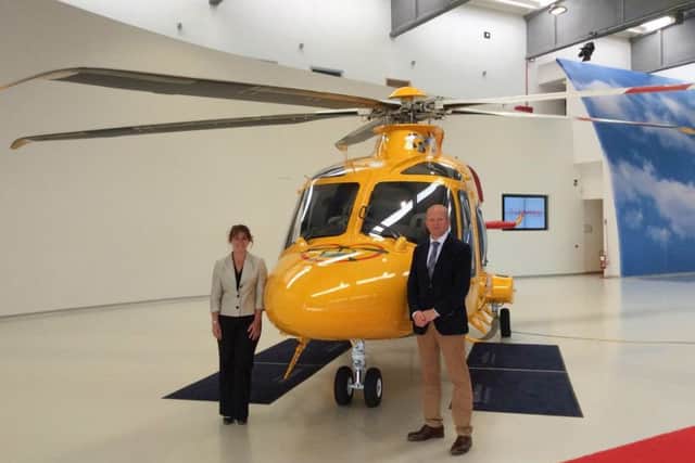Inspecting the new ambucopter in Italy. Karen Jobling, chief executive of Lincs & Notts Air Ambulance, and Jack OHern joint chairman of Lincs & Notts Air Ambulance Board of Trustees. EMN-160607-135057001