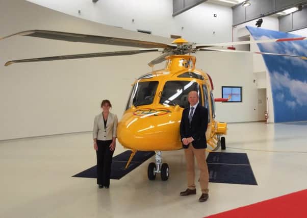 Inspecting the new ambucopter in Italy. Karen Jobling, chief executive of Lincs & Notts Air Ambulance, and Jack OHern joint chairman of Lincs & Notts Air Ambulance Board of Trustees. EMN-160607-135057001