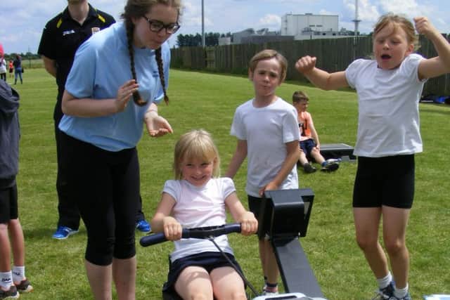 Brooke Bedford, 7, of Digby School  is cheered on in rowing. EMN-160607-150100001