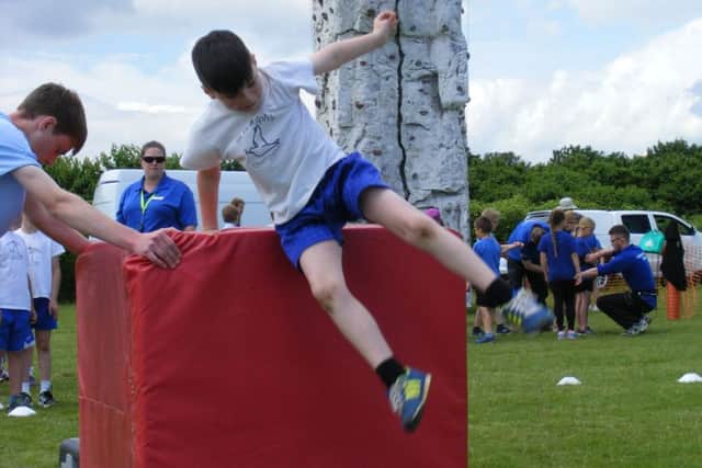 Taking a leap - St Botolphs School pupils from Quarrington show their free runnning skills. EMN-160607-145908001