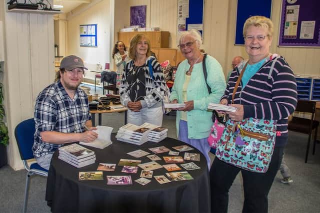 Wayne Barton signs copies of his new book 'Mablethorpe'.