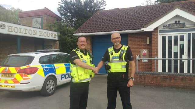 PC Rich Precious with PC Ian Clark outside the Louth Rural police station in Holton le Clay.