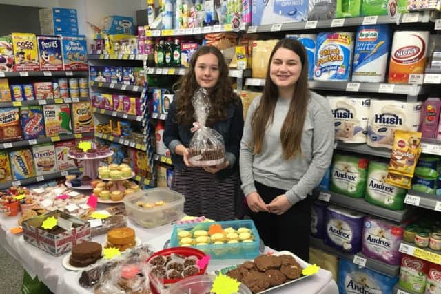 Nepal bound: Ashleigh Burton-Melling and Hermione Daulat at their fundraising cake sale