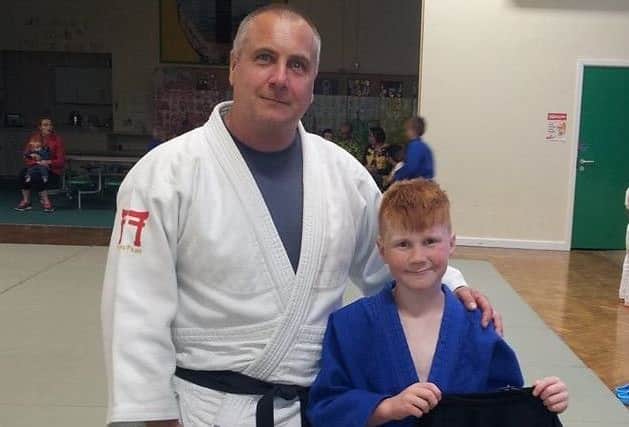 Bradley Meese collects his Judoka of the Month award. KzjBA_zbAjthyQNQ7Daa