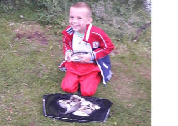 William is pictured with his first bag of fish at Bainside.