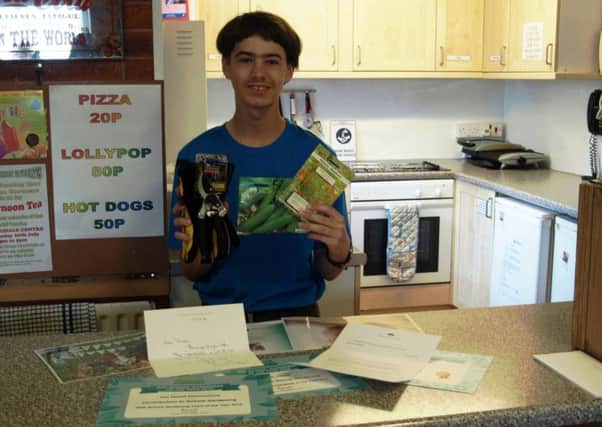 Jordan Havell, pictured with his recent hoard of certificates, official letters and prizes.