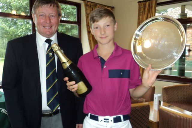 Men's captain Les Brumpton presents Chester Salver to nett champion Charlie Elliott EMN-160718-104528002