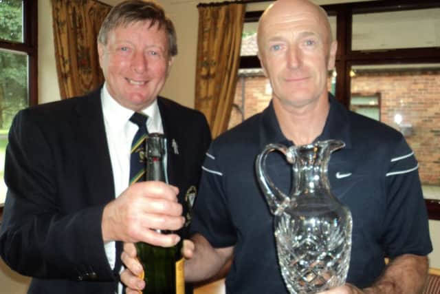 Men's captain Les Brumpton presents Claret Jug to seniors champion Chris Osbourne EMN-160718-104540002