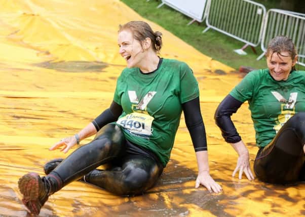Sleaford Striders Alison Siddons and Tracey Dickinson taking part in the Water Wipeout. hRA9Ztbx4_u4c9x7AODE
