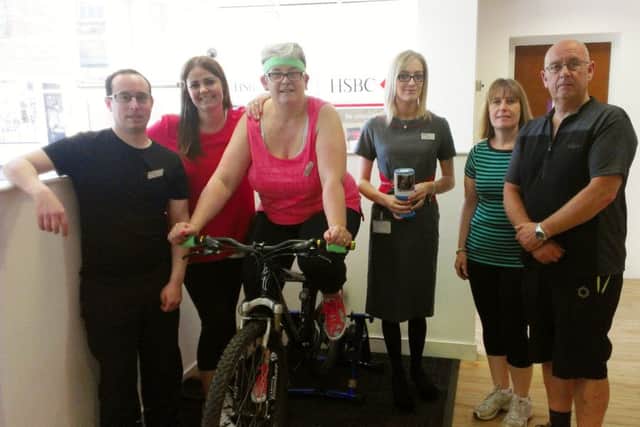 Staff at the Louth branch of HSBC bank are 'keeping fit' this week to raise funds for dementia.