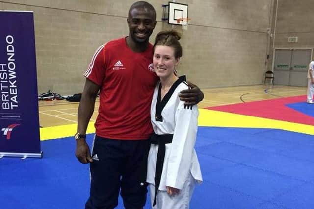 Megan Featherstone with Mahama Cho.